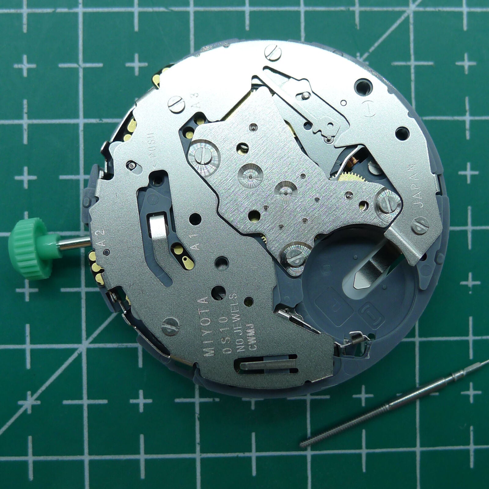 Miyota OS10 quartz watch movement with date window at 3 o'clock, reliable Japanese mechanism for precise timekeeping.