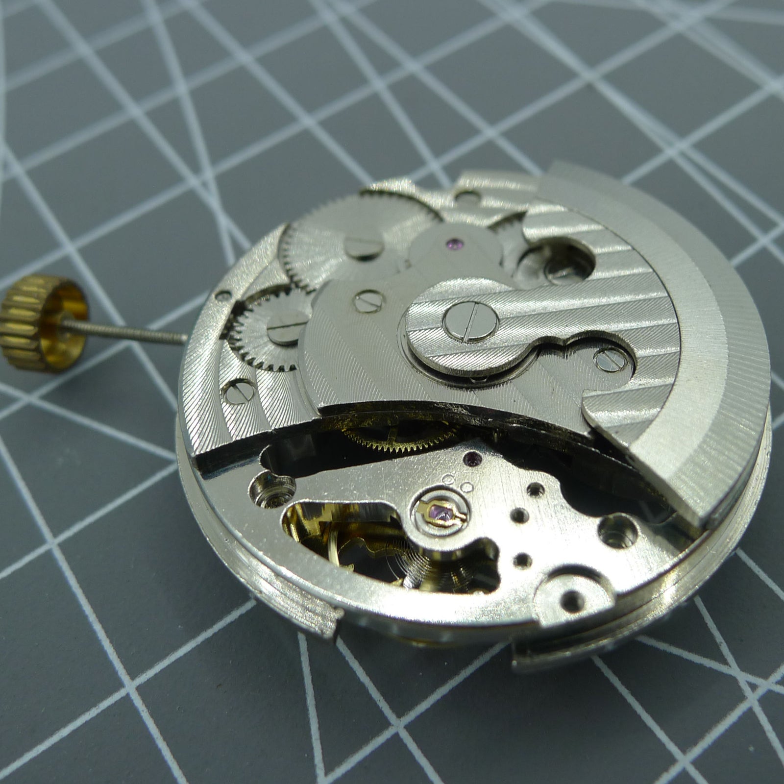 Automatic mechanical watch with silver three hands and hollow moon phase display at 12 o'clock.