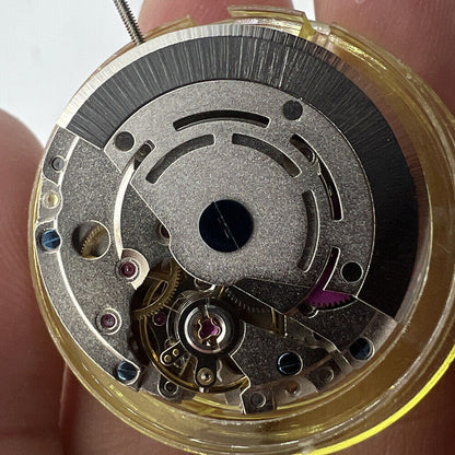 Asian Mingzhu GMT2813 automatic watch movement with dual time zone feature for precise timekeeping.