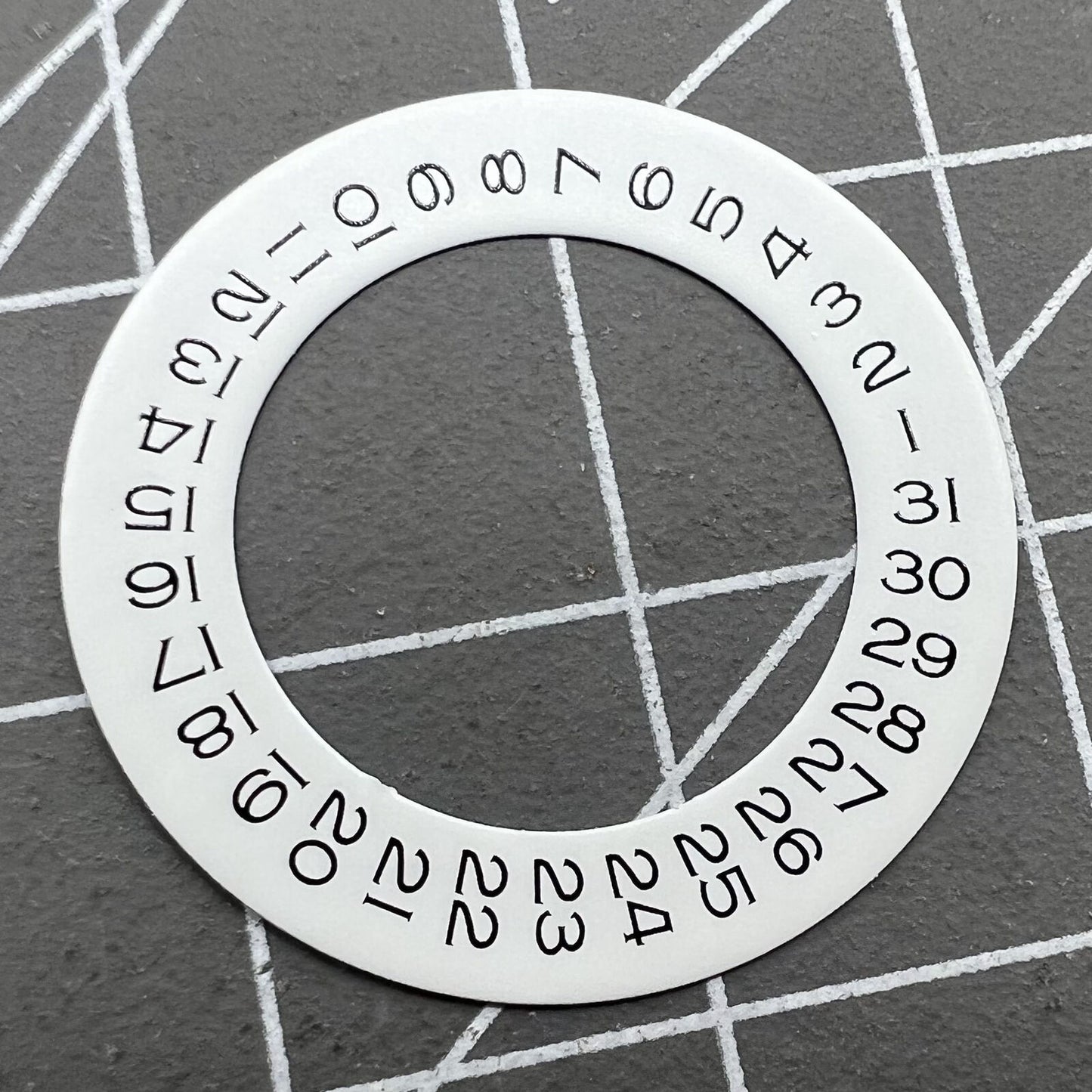 Wide brim white date wheel overlay for ETA 2836 movement with date display at 3 o'clock.