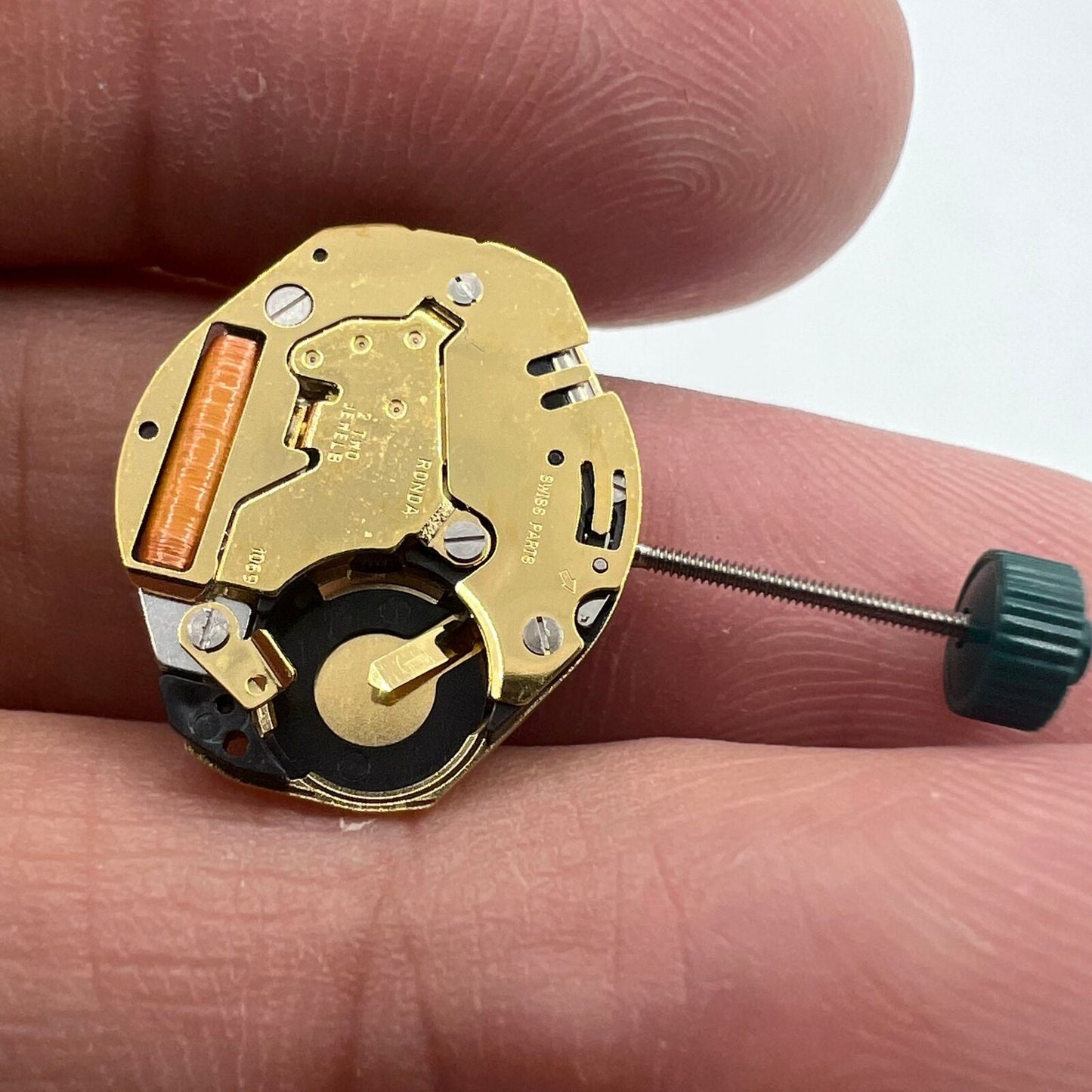 Ronda 1069 golden plated quartz watch movement for precise Swiss timekeeping, ideal for watch repairs.
