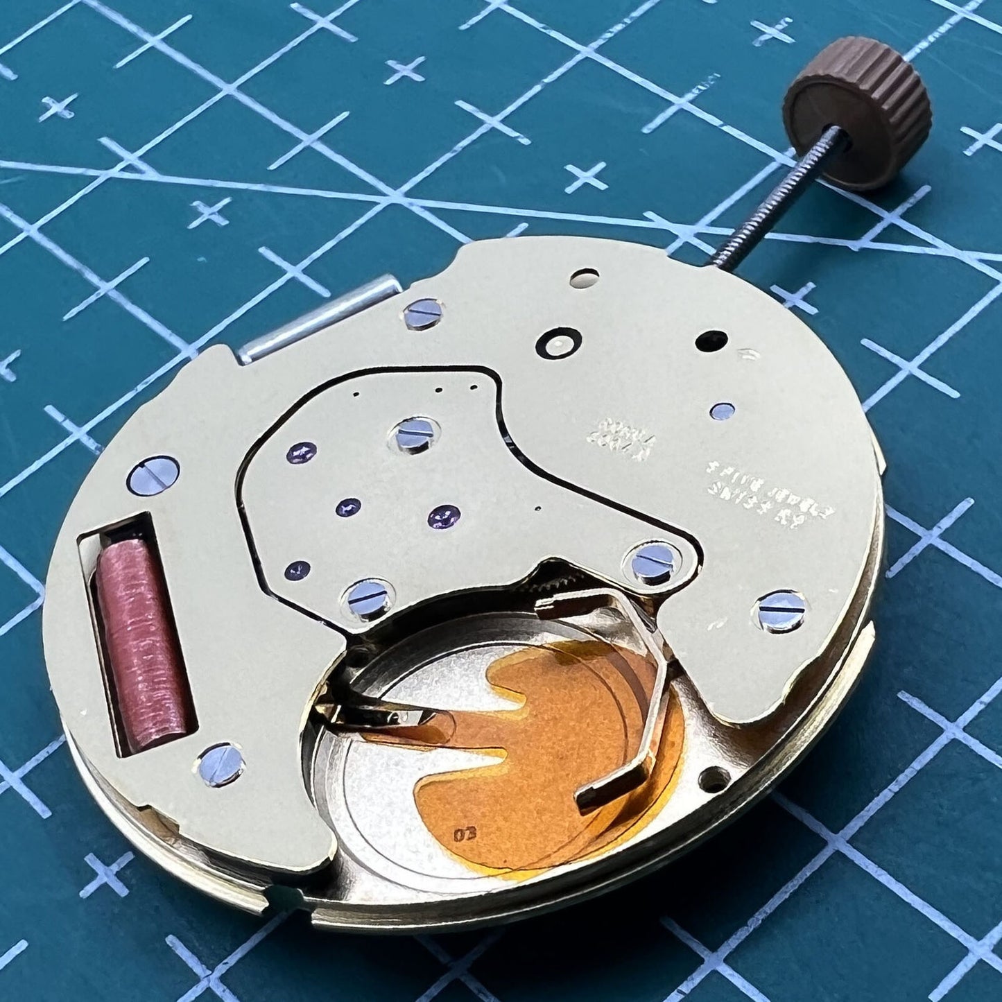 Swiss Made Ronda 6004D quartz watch movement with date at 3 o'clock, perfect for precise repairs.