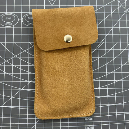 Brown Cowhide watch storage bag, soft-lined travel pouch protecting single watch securely.