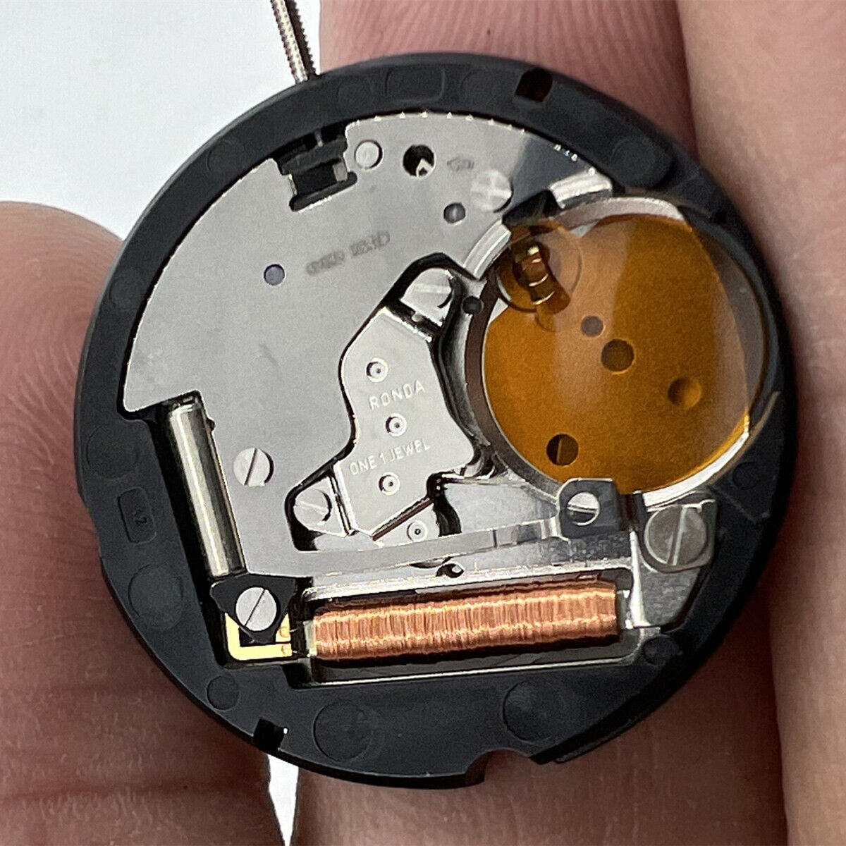 Ronda 507 quartz watch movement with Swiss parts featuring English and Chinese characters by Ronda.