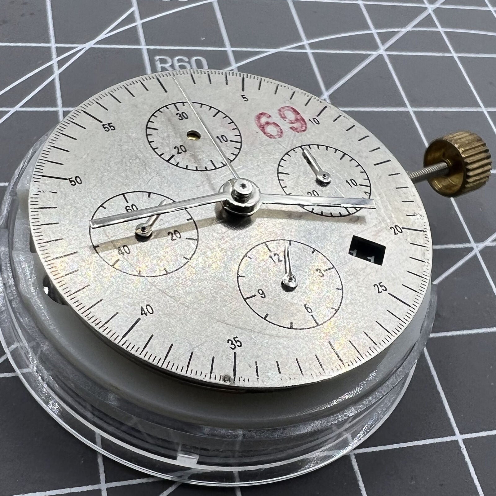 Asia Made 7750 mechanical watch movement with black dial, single calendar, and small second subdials at 3, 6, and 9 o'clock positions.