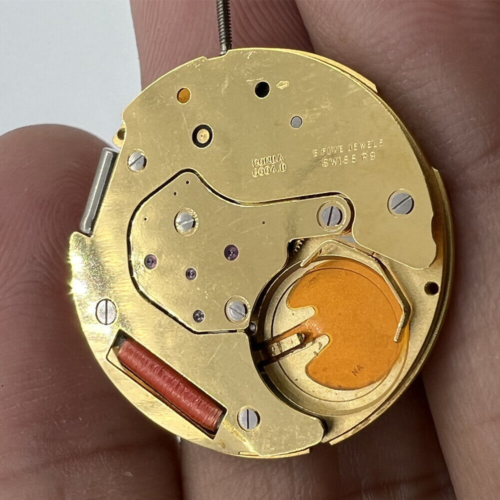 Ronda 6004D Swiss quartz watch movement with date display at 3 o'clock for accurate timekeeping.