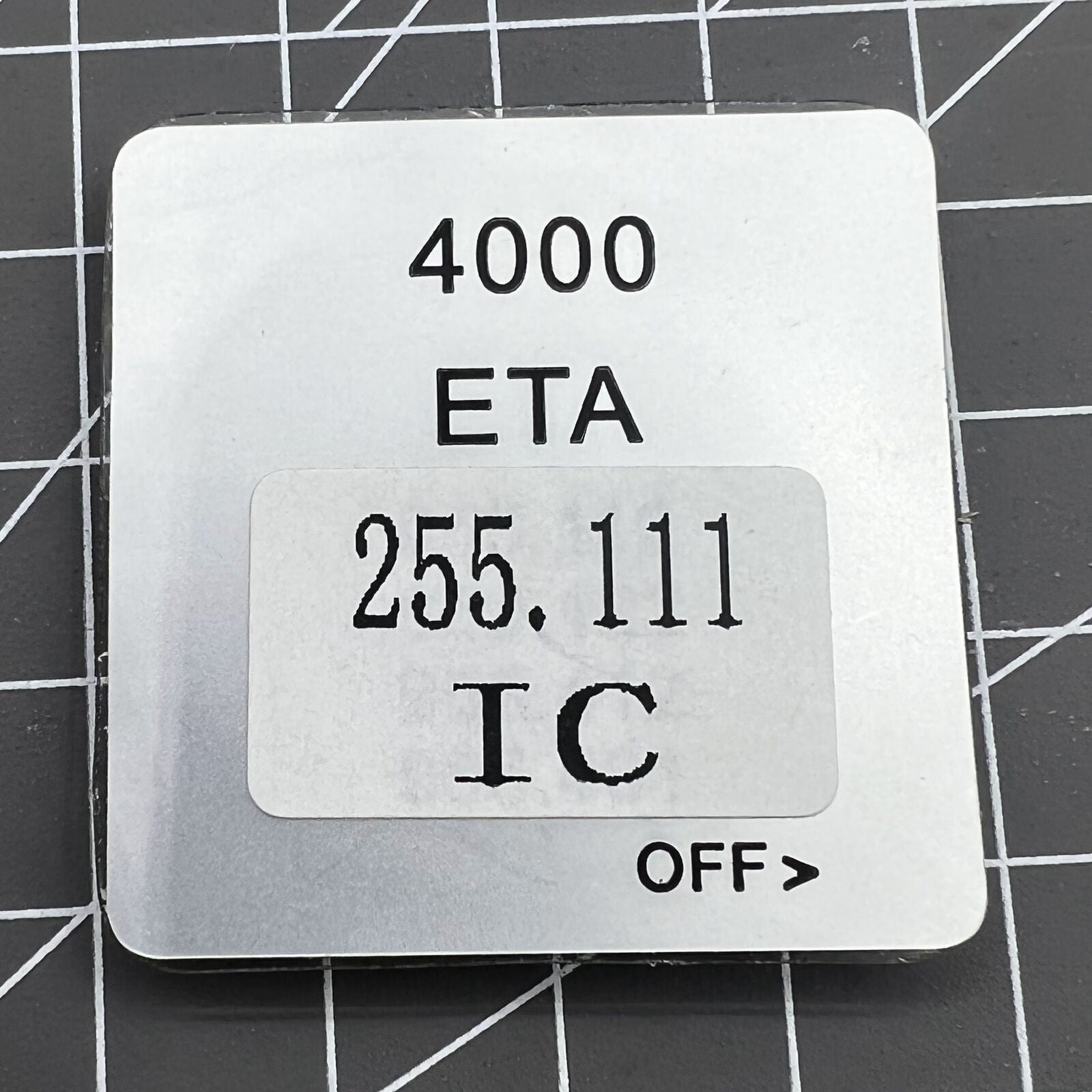 Disassembled ETA 255.111 watch movement circuit board for precise timekeeping replacement parts.