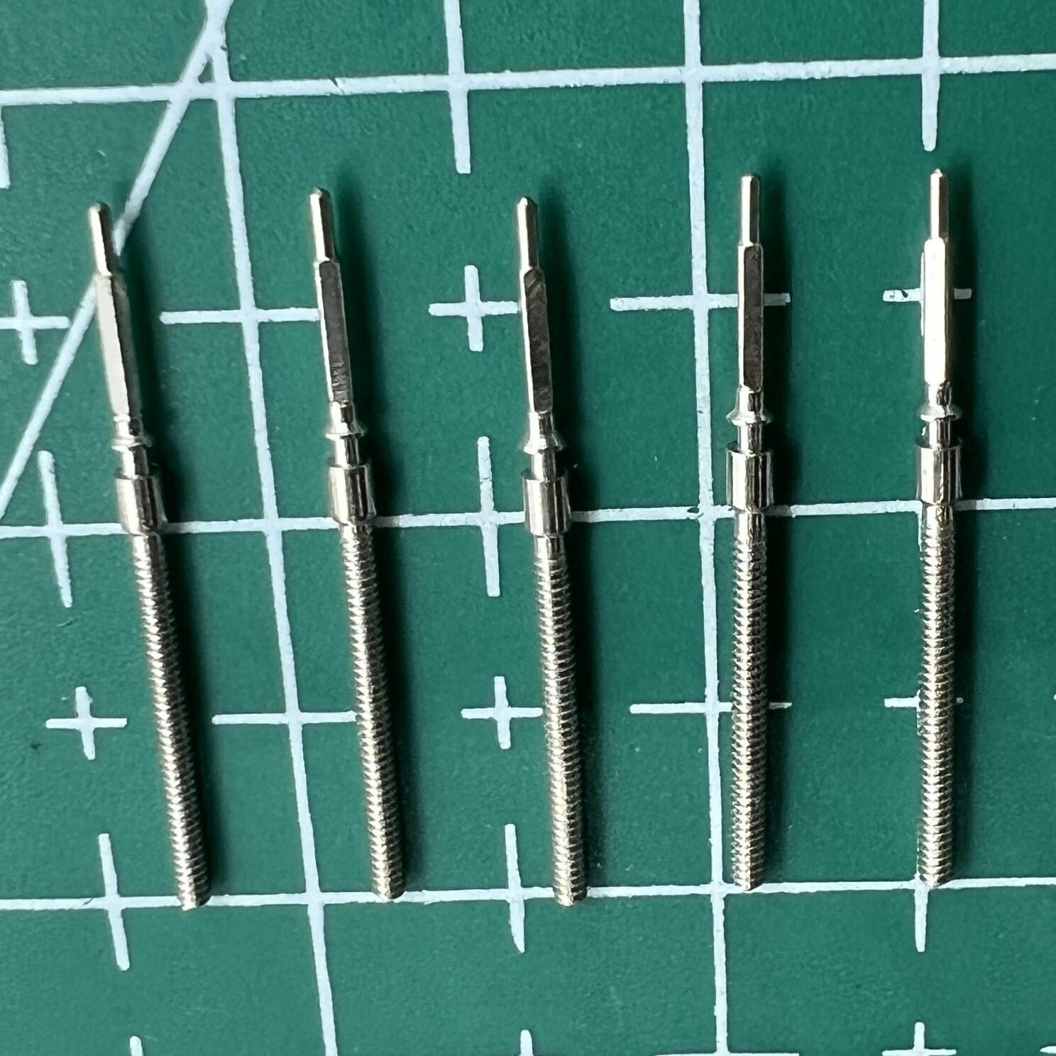 Wholesale lot of durable watch winding stems for 6309 movement, ideal spare parts for Seiko watch repairs.