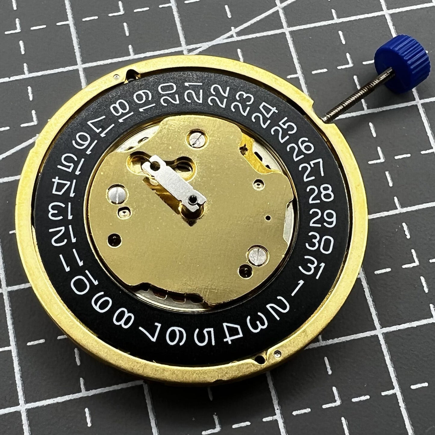 Swiss Made Ronda 5030D quartz movement with black date disk at 4 o'clock for watch repair parts.