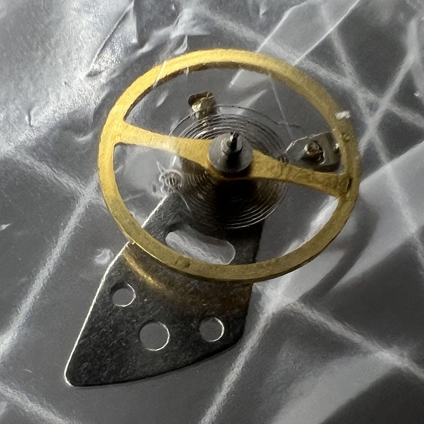 Miyota 8N24 balance wheel with splint for precise watch movement calibration by Miyota.