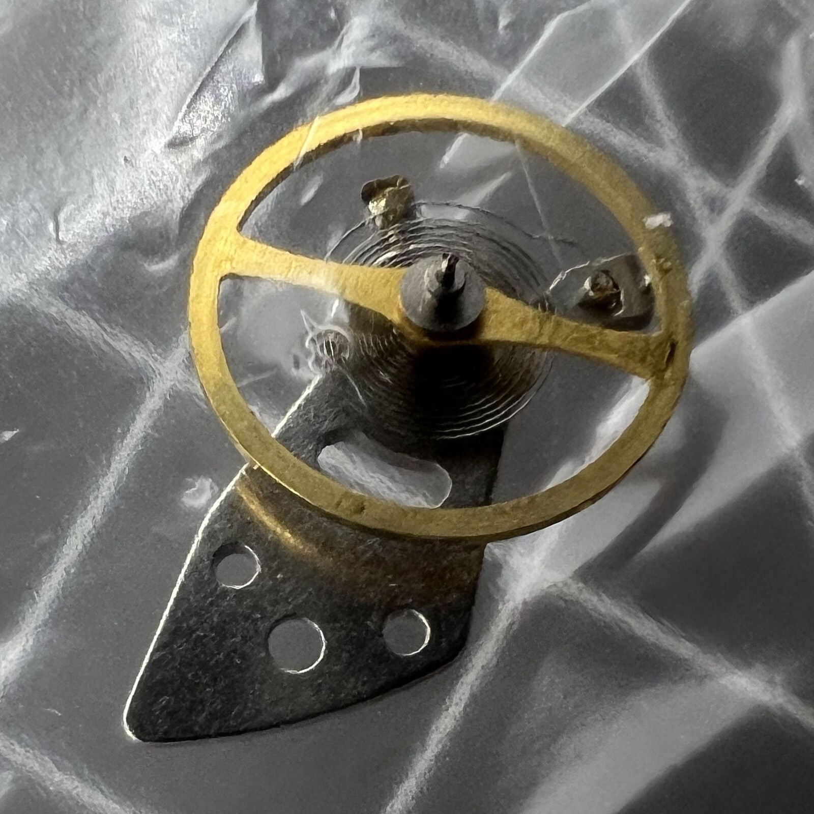 Miyota 8N24 balance wheel with splint for precise watch movement calibration by Miyota.