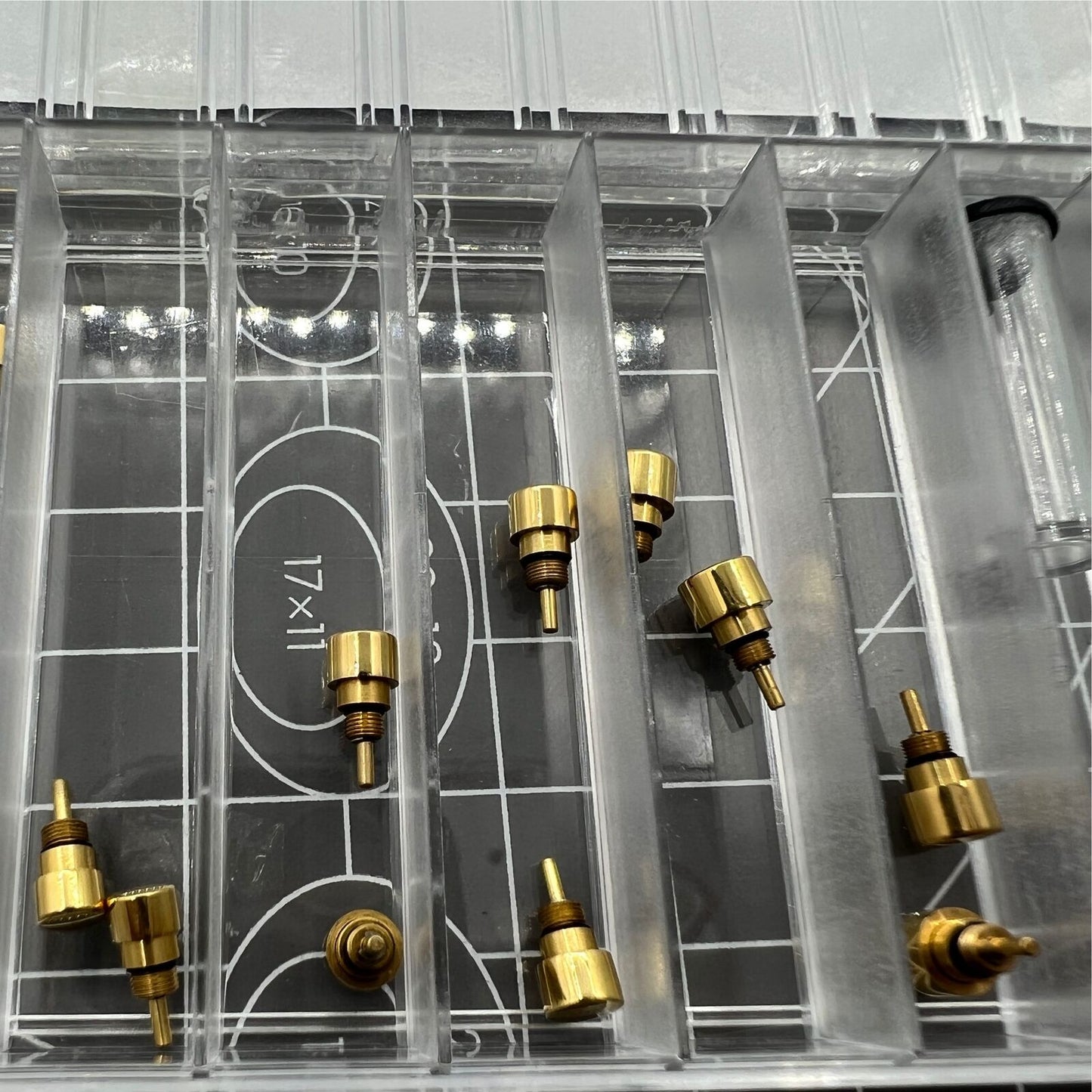 Set of 14 golden stainless steel watch pushers in 7 sizes by trusted brand, ideal for classical drive-in repairs.