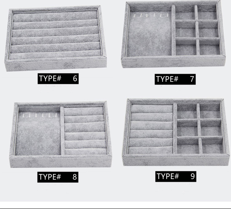 Gray velvet stackable jewelry organizer tray with grid compartments for stylish watch accessories.