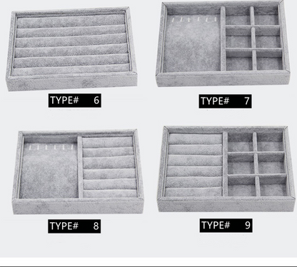 Gray velvet stackable jewelry organizer tray with grid compartments for stylish watch accessories.