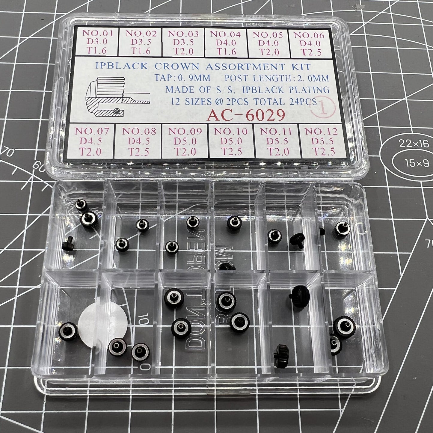 Black plated stainless steel watch crowns, 24 pieces in 12 sizes, perfect for watch repairs and customization.