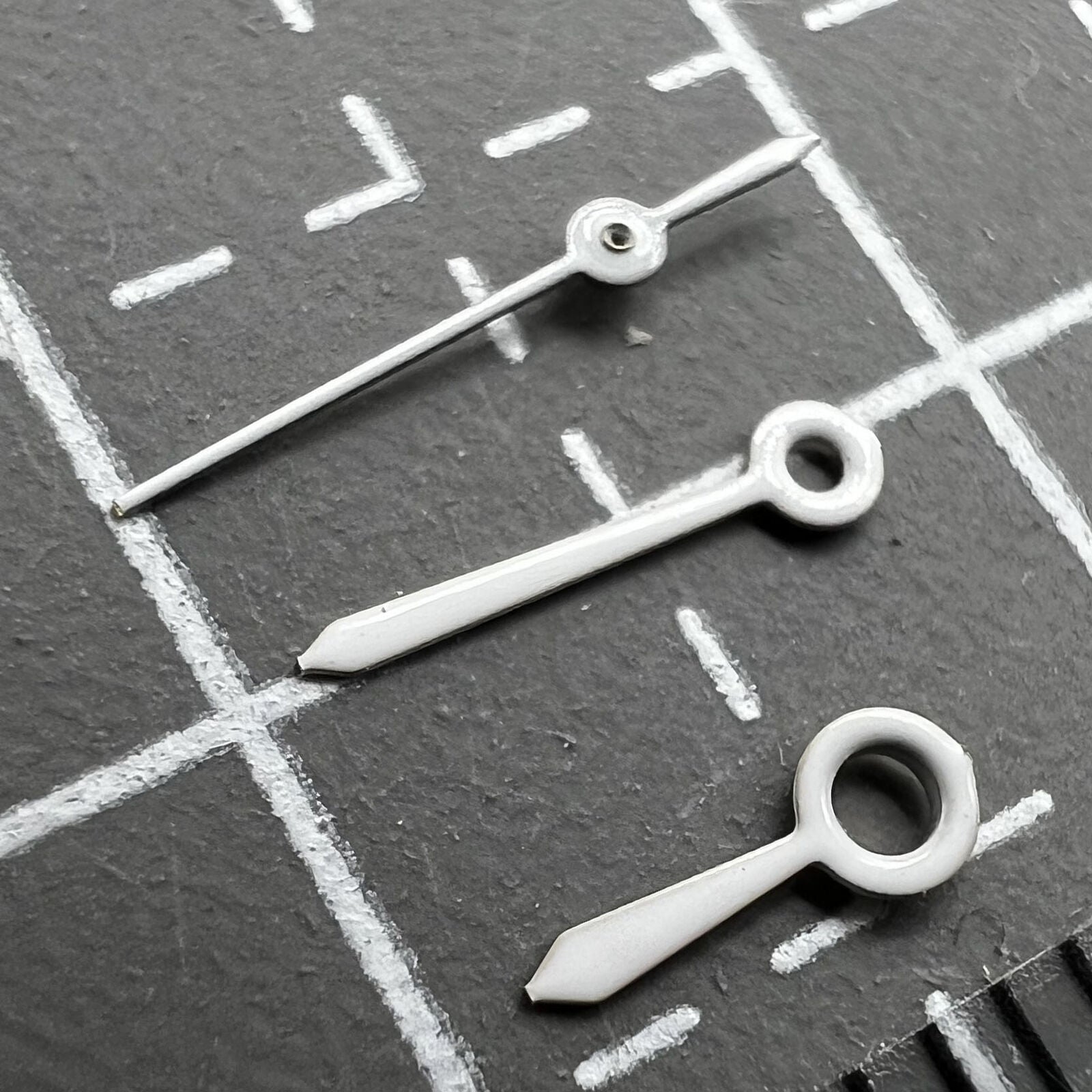 6mm Epson TMI white no lume watch hands set for VJ22 quartz movement, precise fit for repairs.