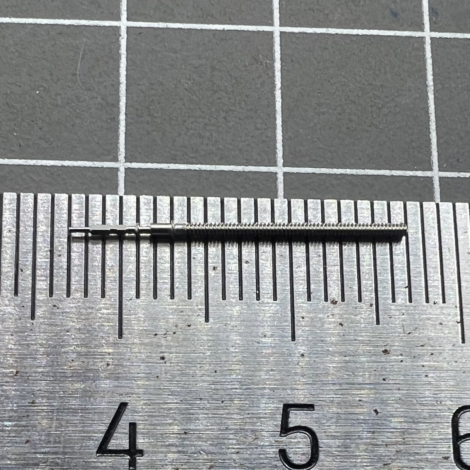 Watch winding stem VX12E, spare part for precise watch repair and maintenance.