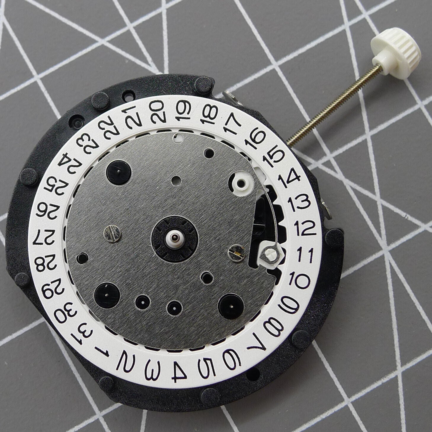 LD57 quartz watch repair part showing small second subdial at 6, 9, and 12 o'clock positions for precision timing.