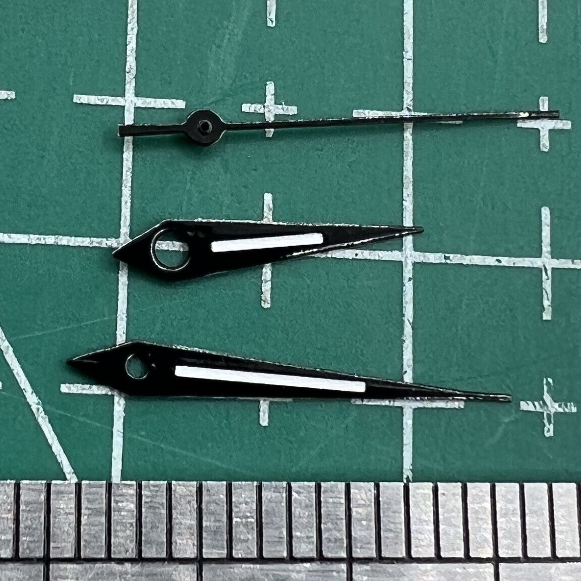 Black trim luminous watch hands for Miyota 2035 quartz movements, ideal for watch repairs.