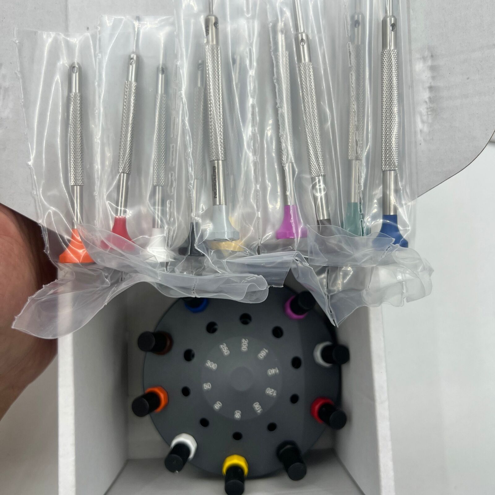 Swiss Bergeon 30081-S10 ergonomic screwdriver set with rotating stand for precise watch repairs and adjustments.