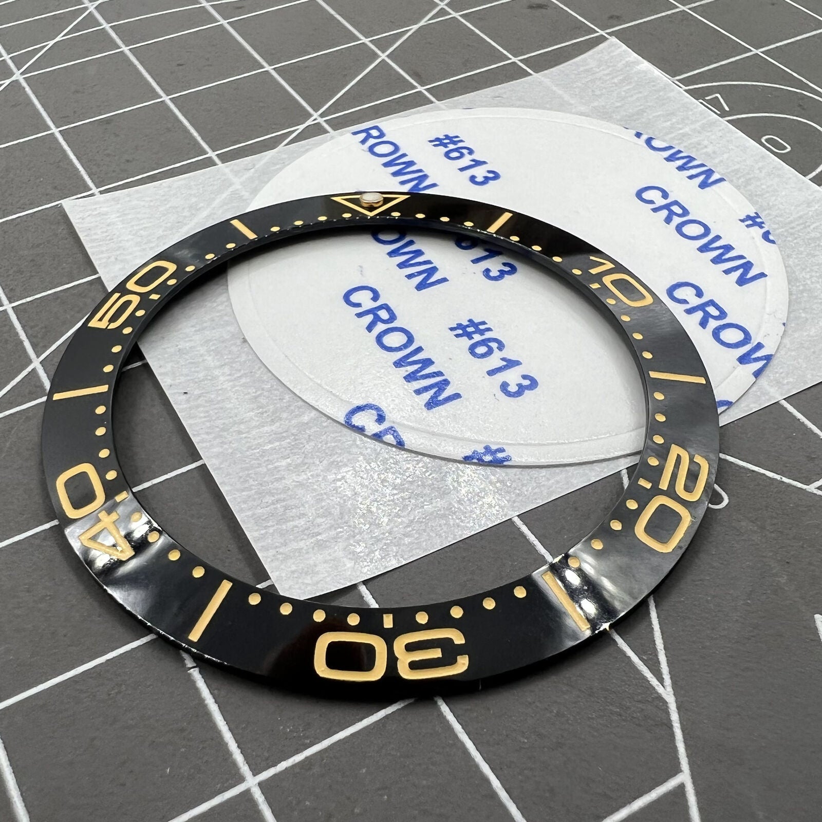 Black ceramic watch bezel insert with yellow font, 41.5mm/32.5mm size for stylish accessory upgrades.