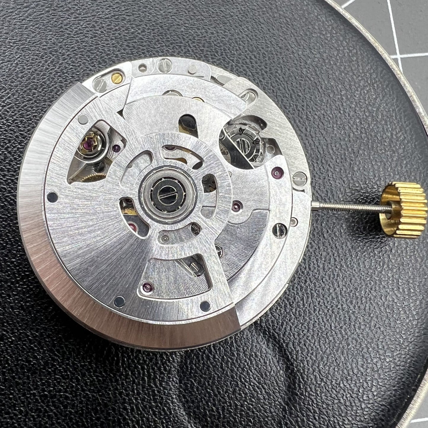 SL4801 automatic watch featuring multifunctional mechanical movement and small second subdials at 3, 6, and 9 o'clock positions.