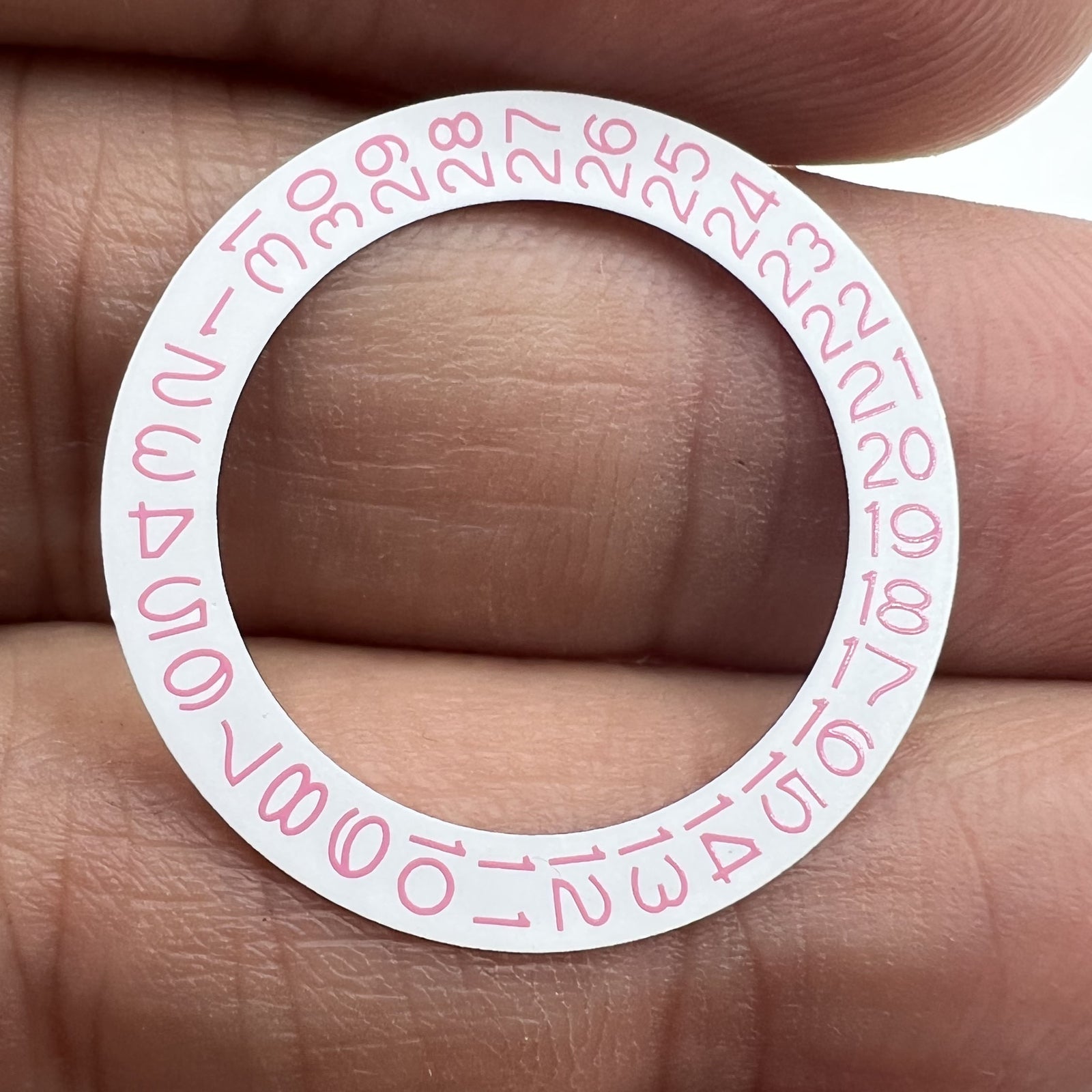 Pink character date wheel for NH35 NH36 watch movement, showcasing clear date numbers on white background.