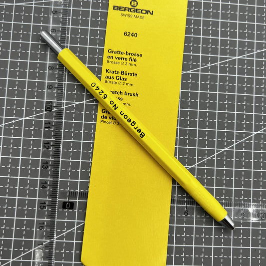 Swiss Bergeon 6240 glass fibre scratch brush for watch glass repairs, precision cleaning tool.