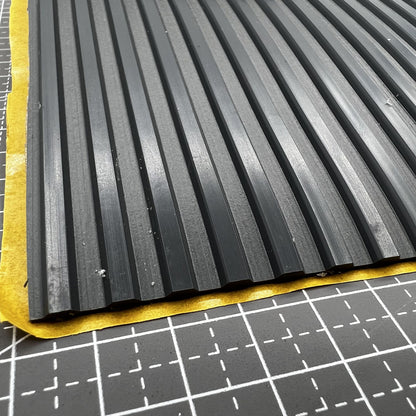 Swiss Bergeon 5965-D grooved self-adhesive bench mat for watch repair workspace protection and accessory organization