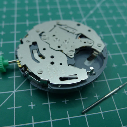 Miyota OS10 quartz watch movement showing date at 3 o'clock, precision Japanese mechanism for accessories.