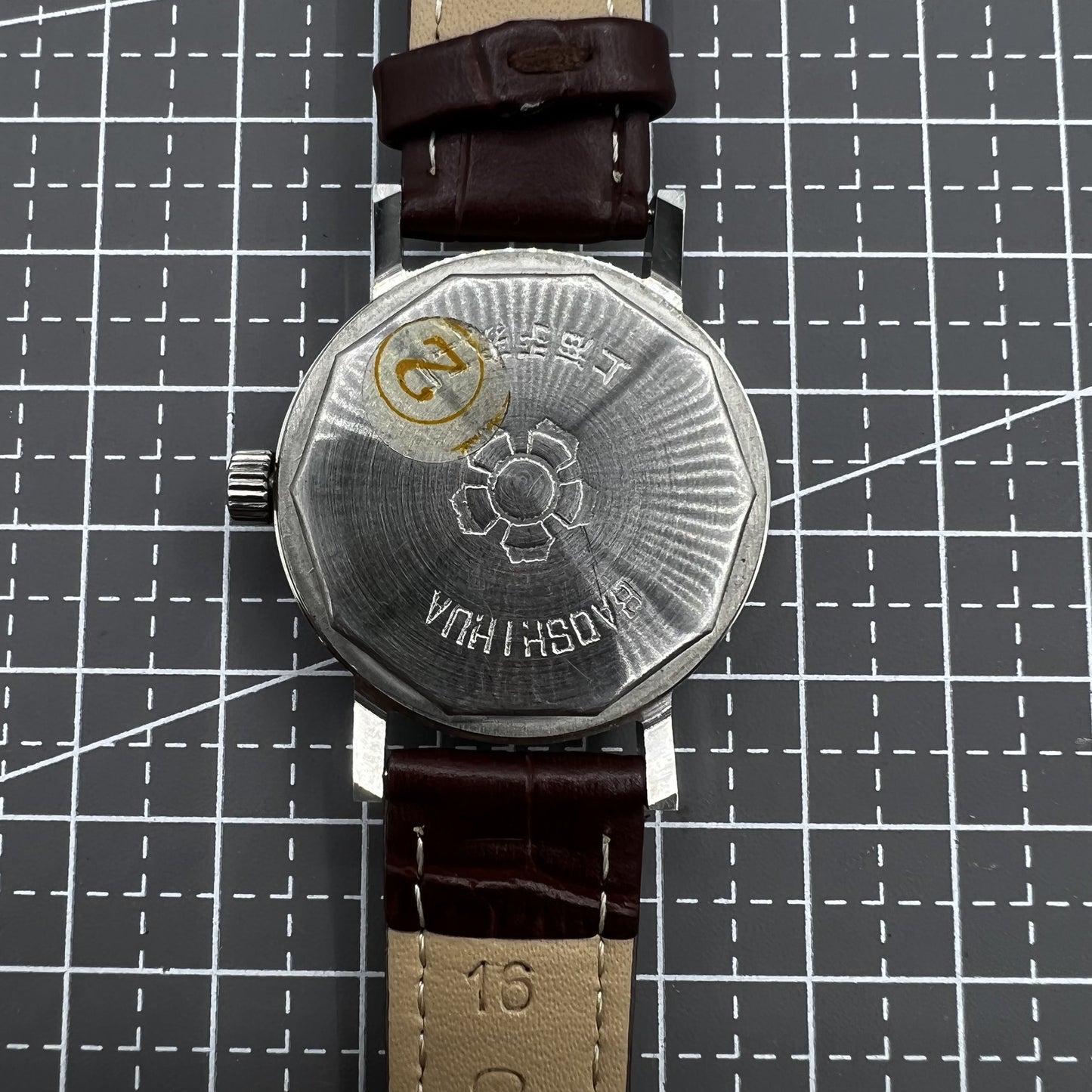 33mm Shanghai manual mechanical watch with single calendar, 17 jewels, shock-resistant design for classic timekeeping.