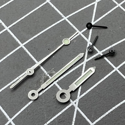 Silver-trimmed green luminous watch hands for Miyota OS10 movement, enhancing readability and style.