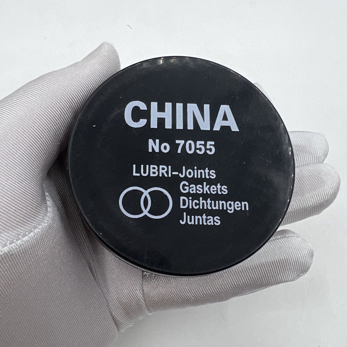 Lubri-Gaskets foam sealing cushions in box, grease lubricator for watch accessories by China Made, ensuring secure watch part protection.