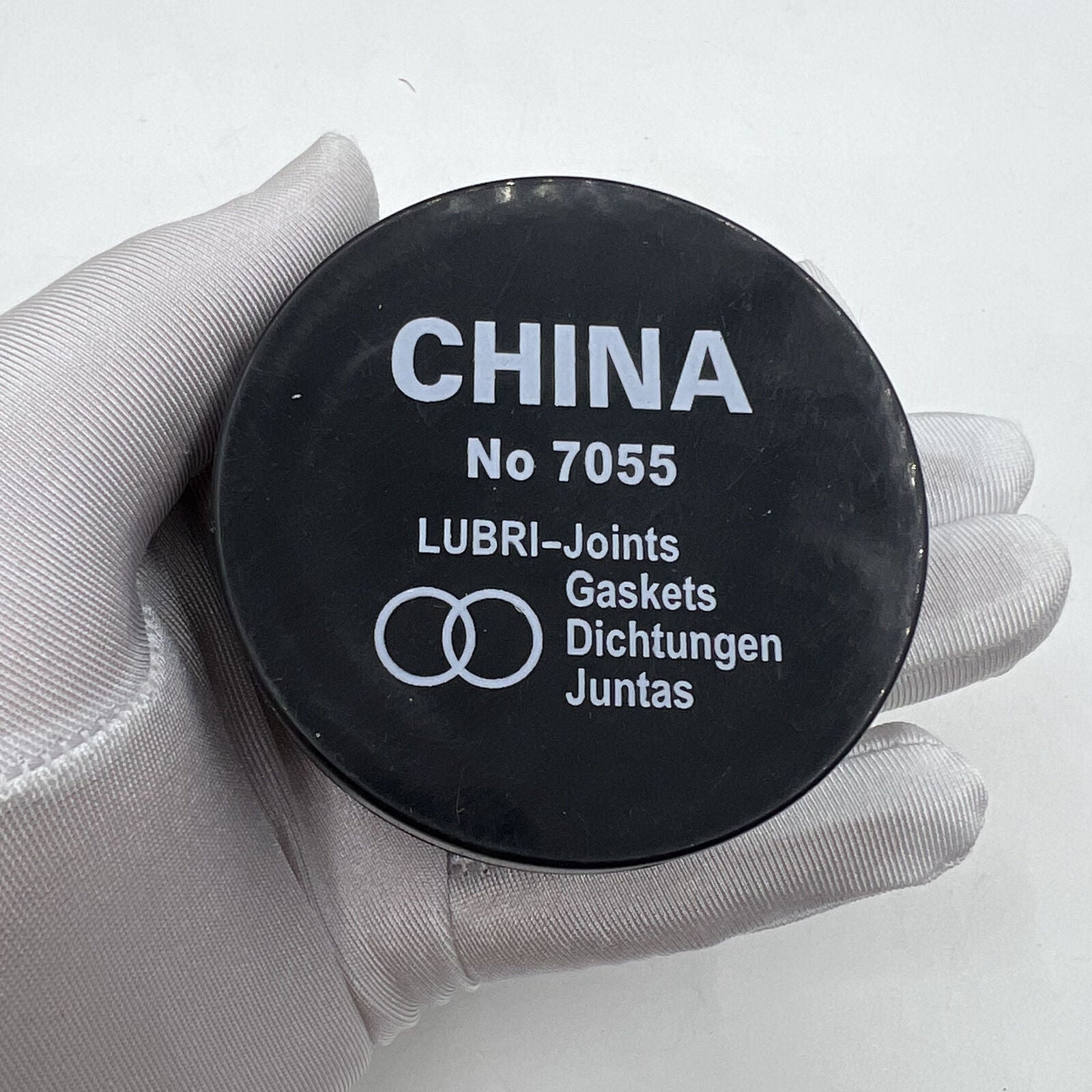 Lubri-Gaskets foam sealing cushions in box, grease lubricator for watch accessories by China Made, ensuring secure watch part protection.