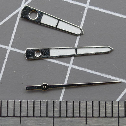 Silver arrow-shaped 12mm watch hands for Miyota 2315, precise accessory enhancing timepiece accuracy.