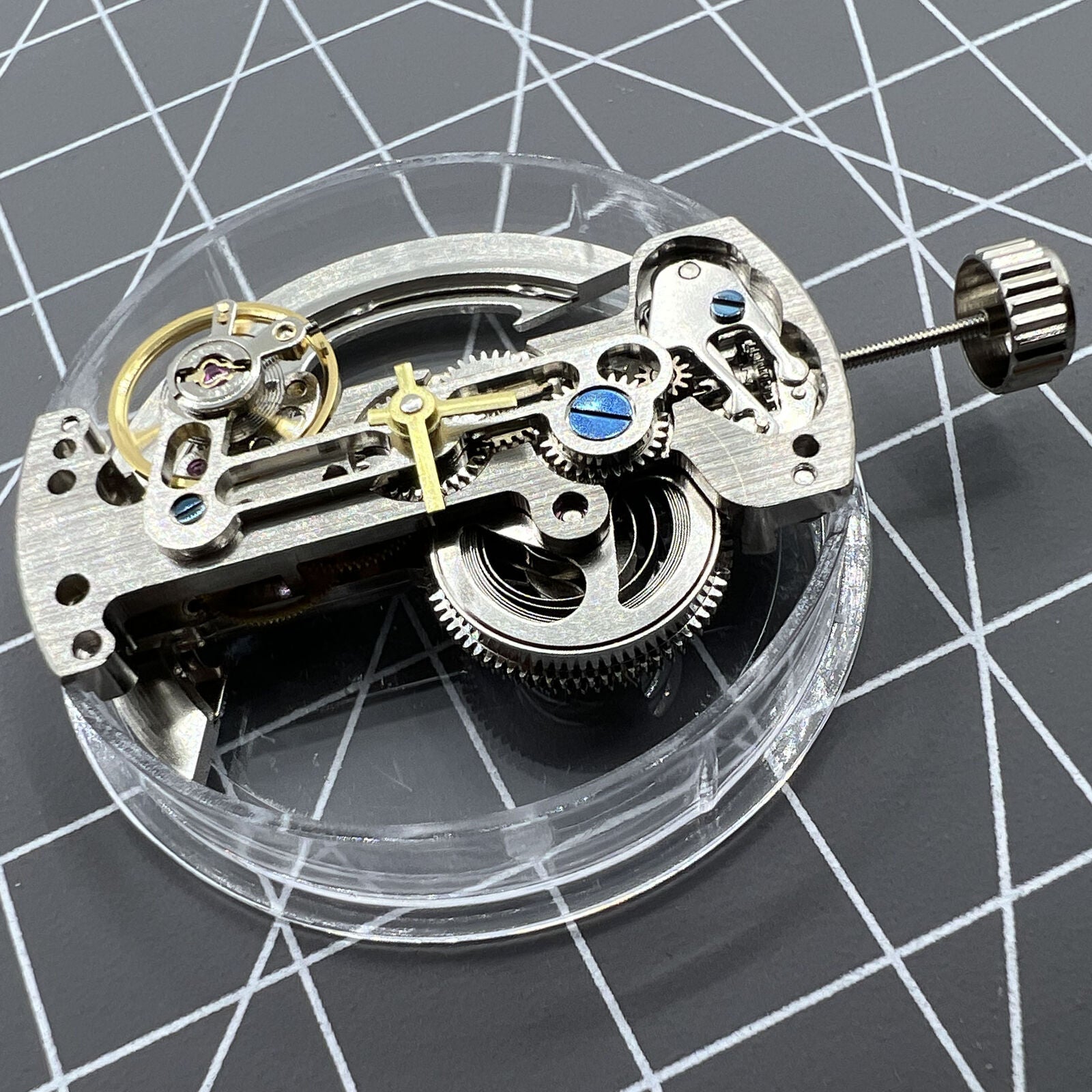 Asian LG0807 silver rectangle watch with visible bare balance wheel and automatic mechanical movement.