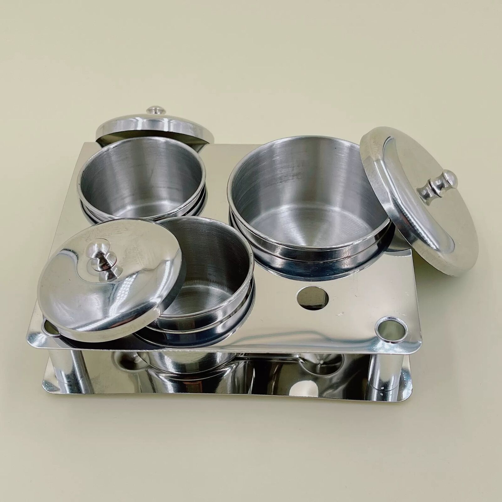 Stainless steel watch oil washing jar, essential for precise watch repair and maintenance.