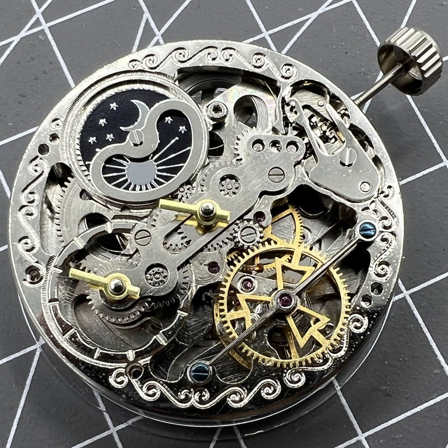 Double Mainspring hollow mechanical watch accessory featuring multi-function and dual time zone design.