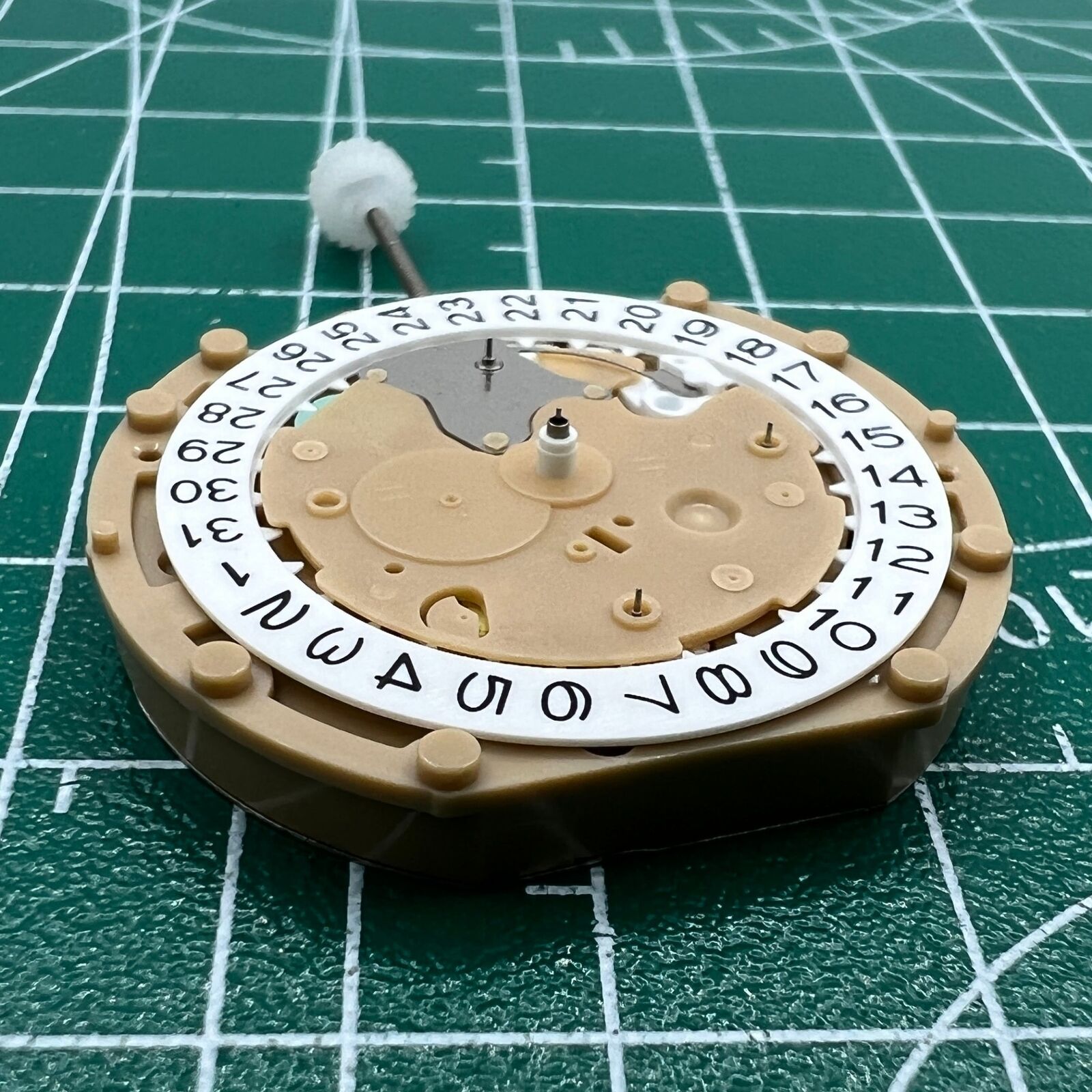 Sunon PE60 quartz watch with date display at 3 o'clock and small seconds subdial at 6, classic 3-hand design.