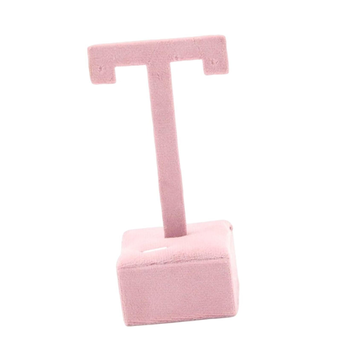 Earring display stand with hanging hooks and decorative shelf for organizing jewelry.