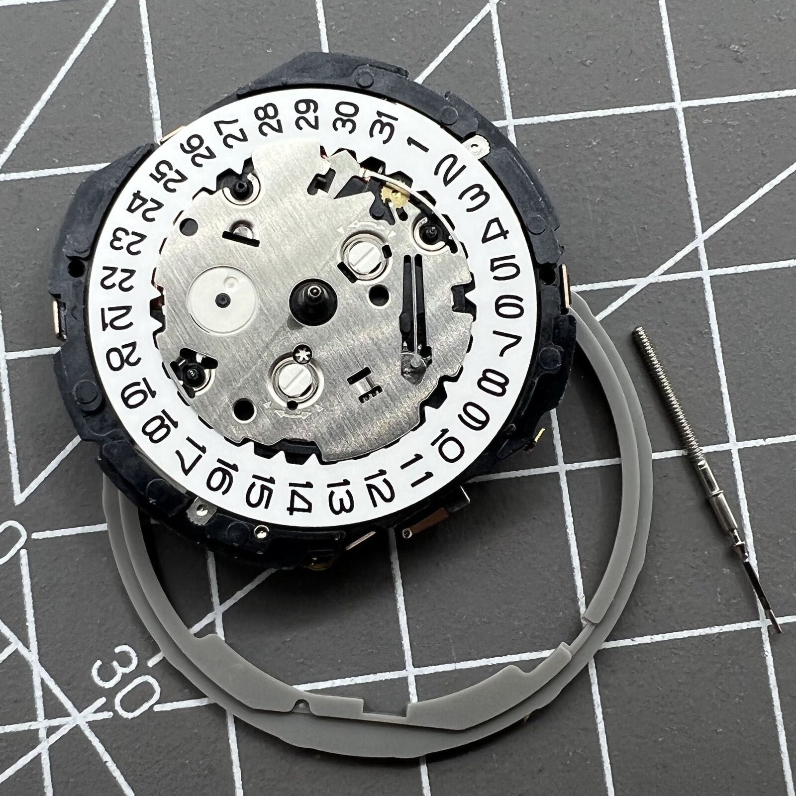 Japan Hattori Epson TMI YM91A quartz watch movement with date display at 3 o'clock, precision made