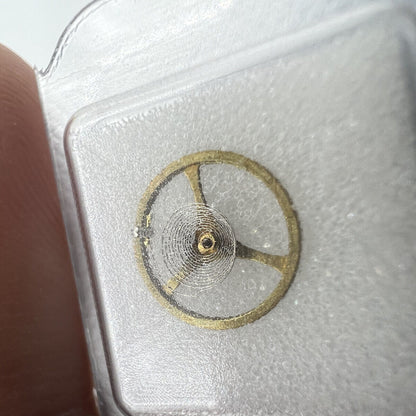 Golden balance wheel with hairspring for 2189 watch movement, precise spare part for repair.