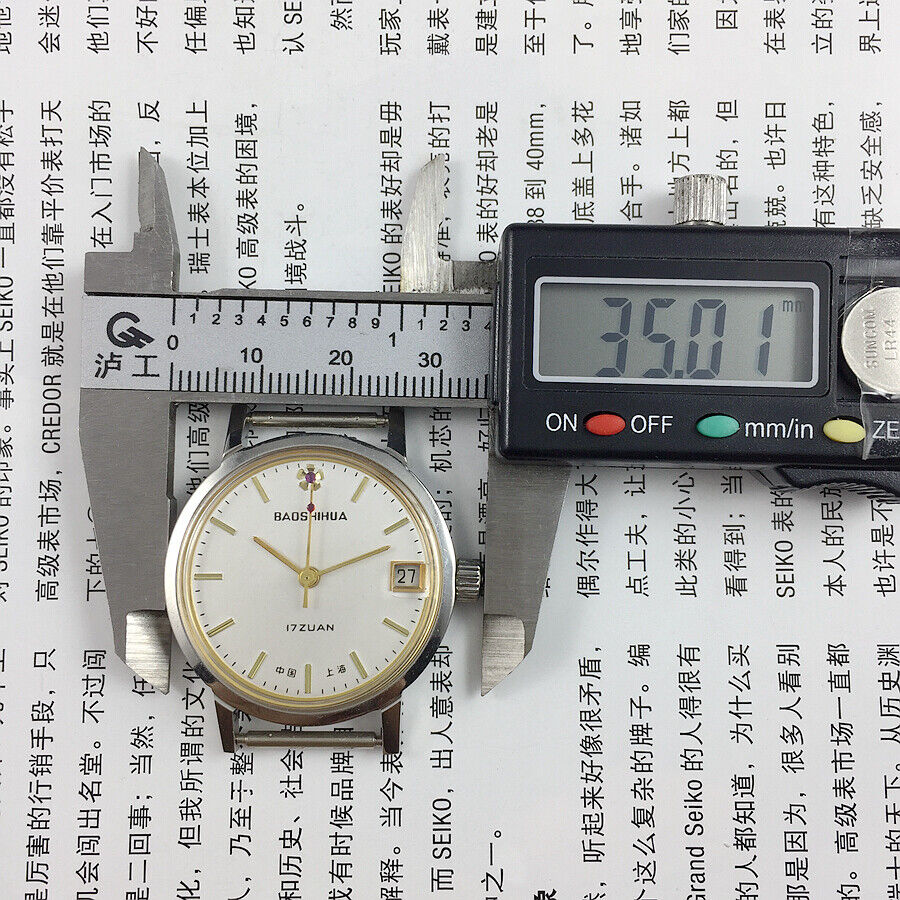 33mm Shanghai manual mechanical watch with single calendar, 17 jewels, shock-resistant design by Shanghai brand.