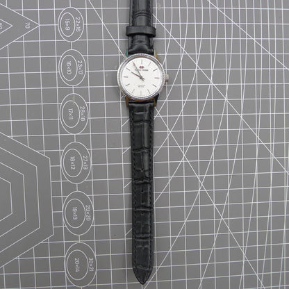 Beijing 31mm manual mechanical watch with silver case and double rhomb dial, showcasing classic Chinese craftsmanship.