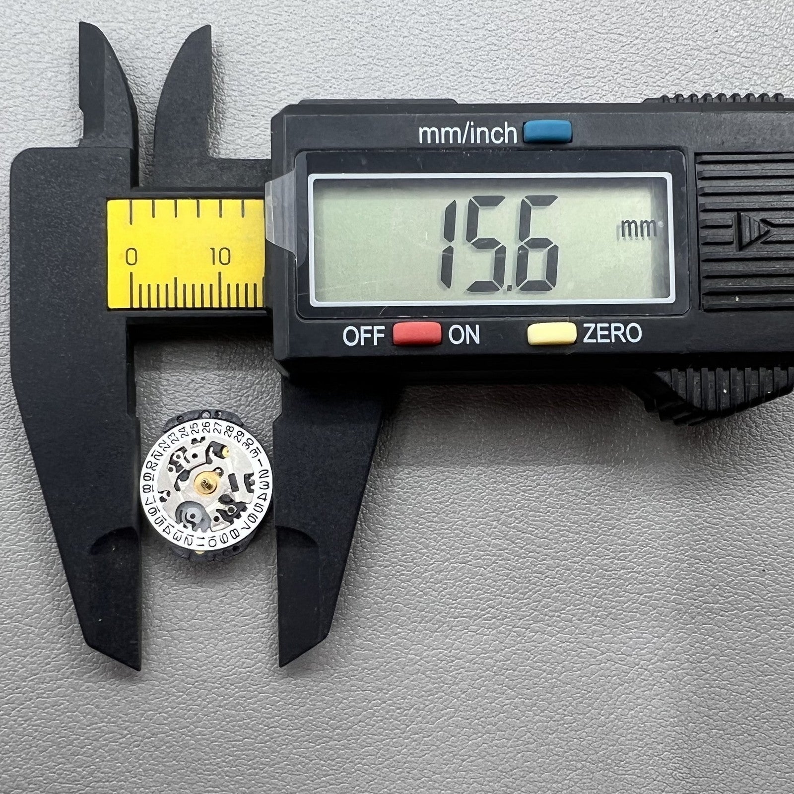 Seiko 7N82D quartz watch movement close-up showing precise timekeeping mechanism for durability.