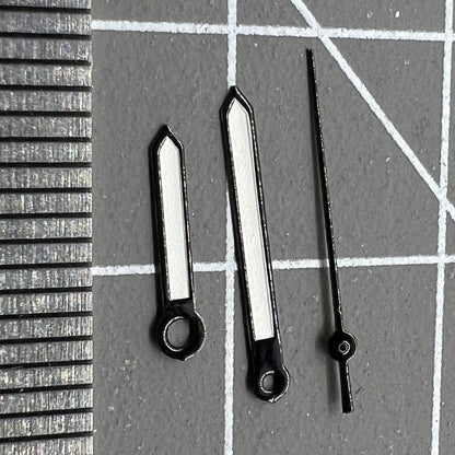 Luminous black trim watch hands compatible with Miyota 2035 quartz, enhancing style and readability.