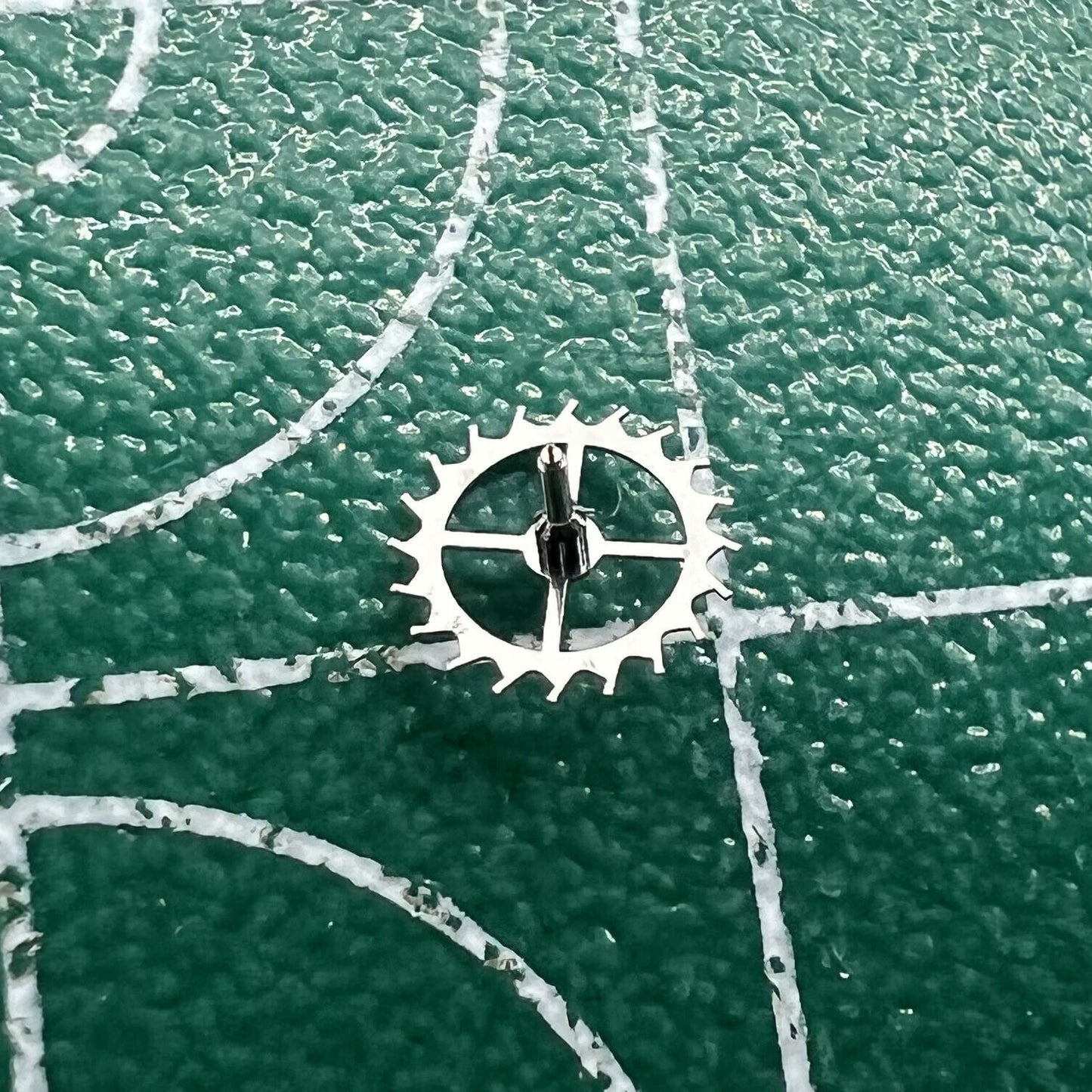 Escape wheel for Dandong 7750 movement, precision watch repair part by Dandong, durable and accurate component.