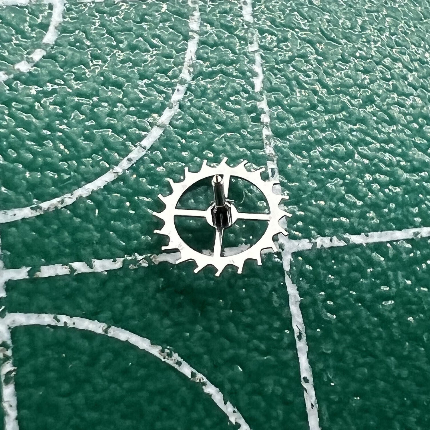 Escape wheel for Dandong 7750 movement, precision watch repair part by Dandong, durable and accurate component.