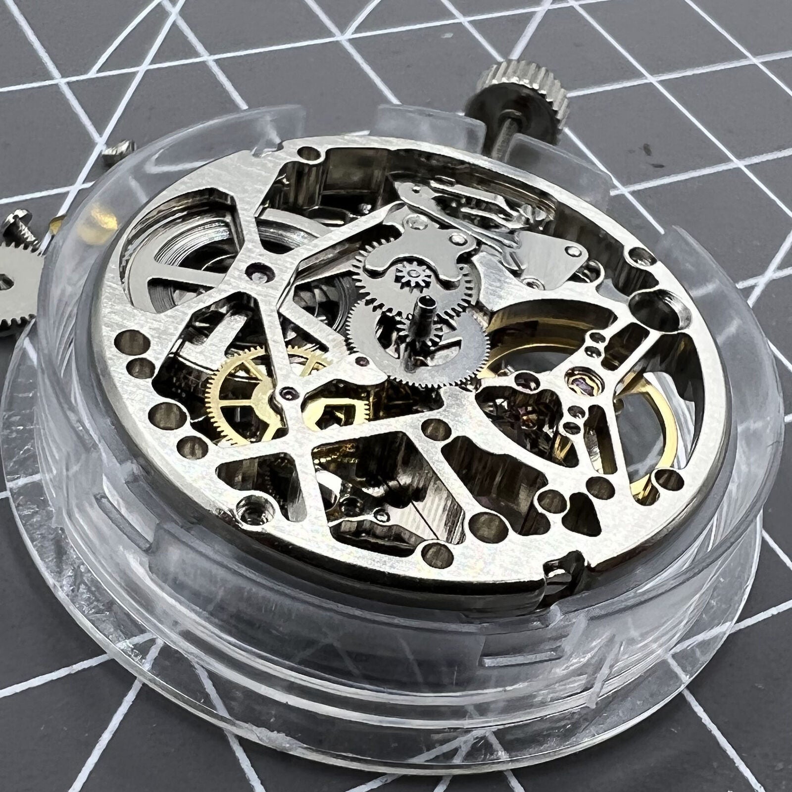 Tianjin Seagull ST25 silver automatic watch movement displaying hollow 3-hand mechanical design for precision timekeeping.