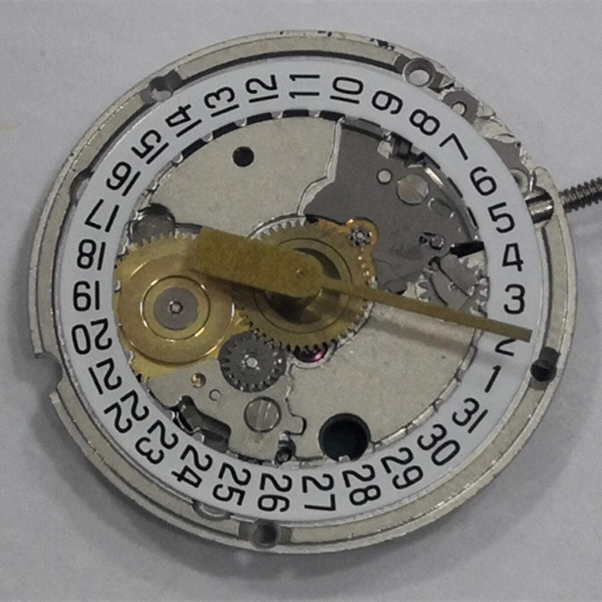 ETA 956.114 white dial quartz watch movement replacement, three-hand design for precise timekeeping.
